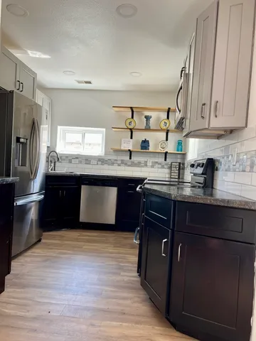 a view of a room with a flat screen tv