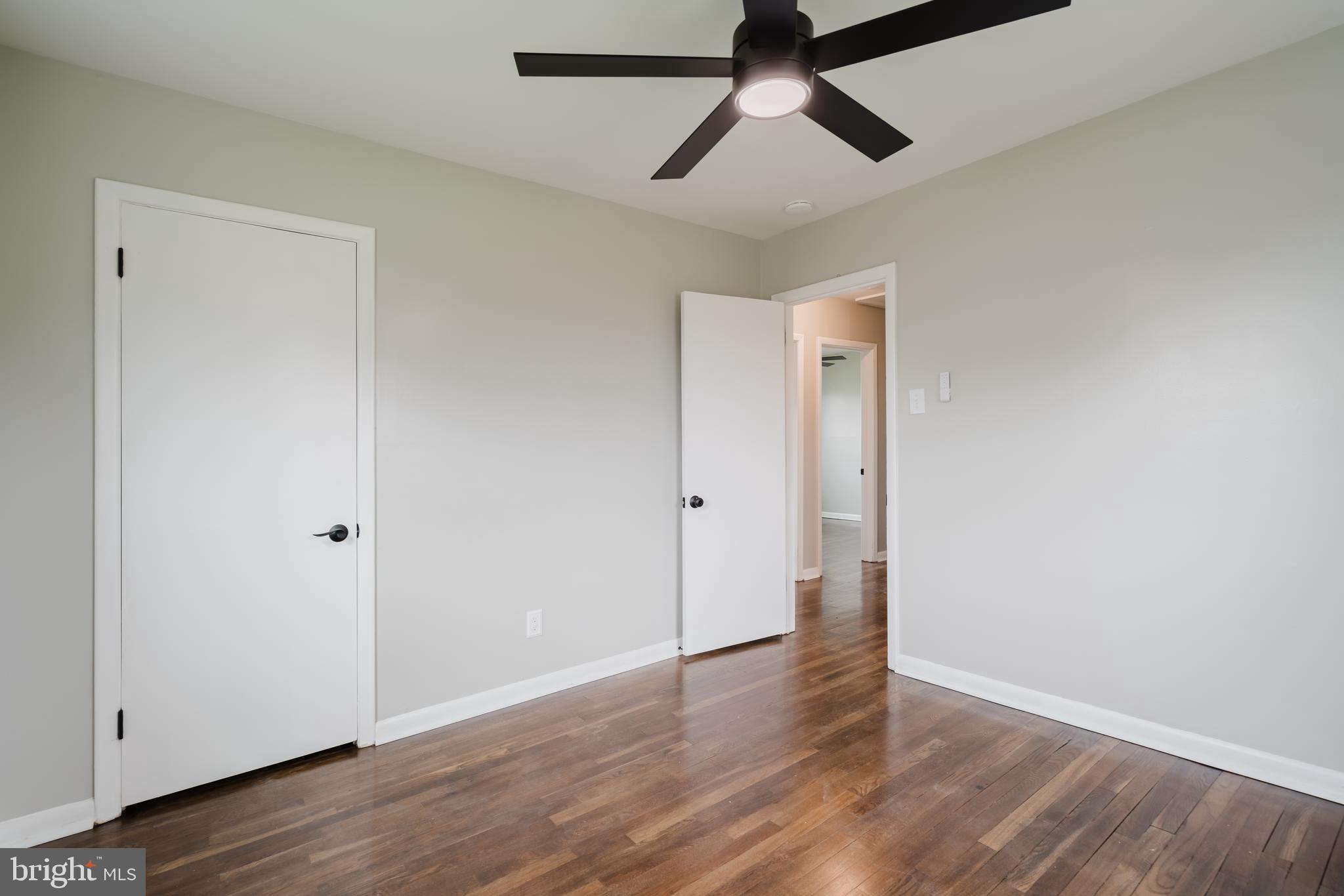 103 Durso Drive Newark, DE 19711 - Photo 13 of 21 an empty room with wooden floor and windows