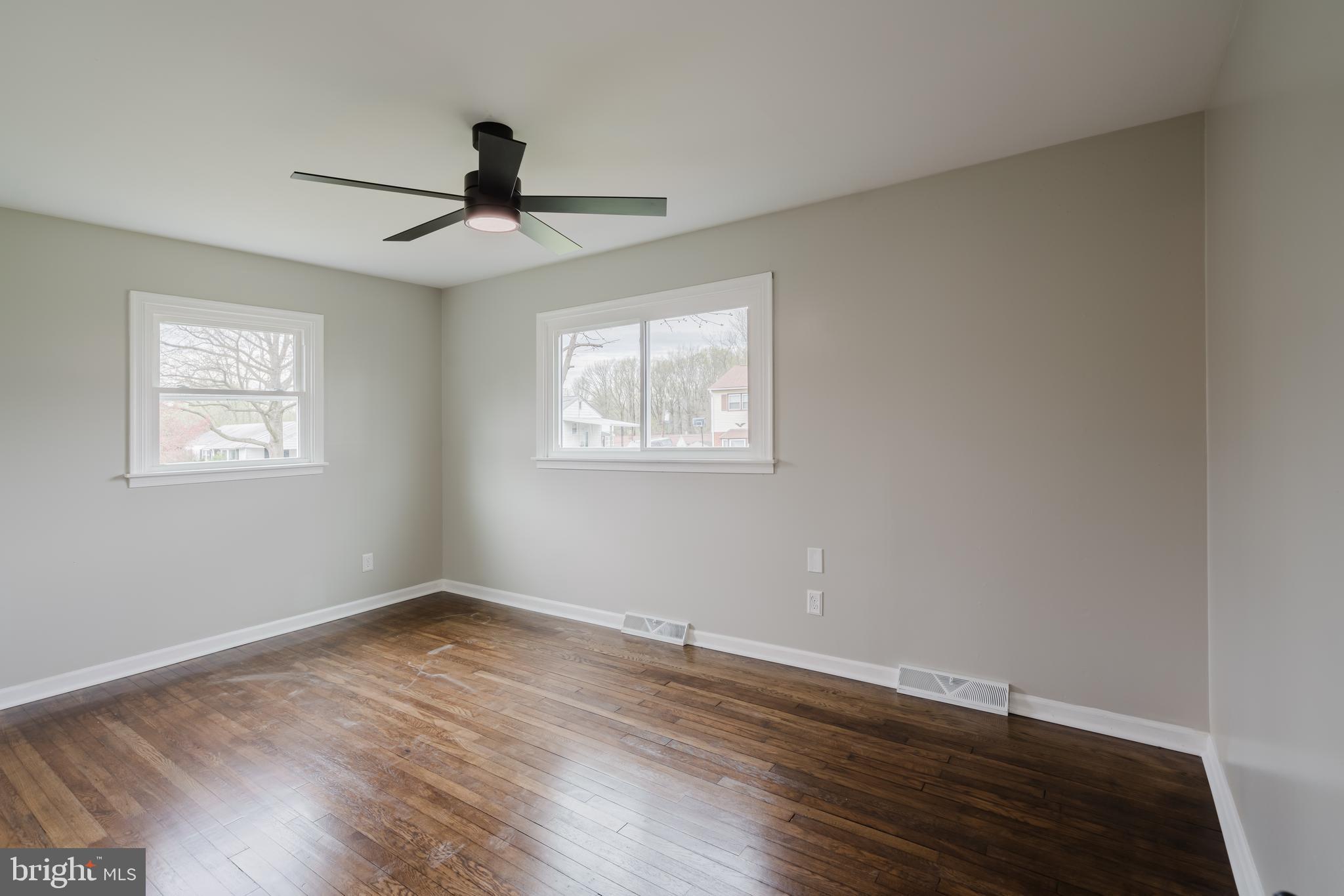103 Durso Drive Newark, DE 19711 - Photo 16 of 21 a view of an empty room with wooden floor and a window