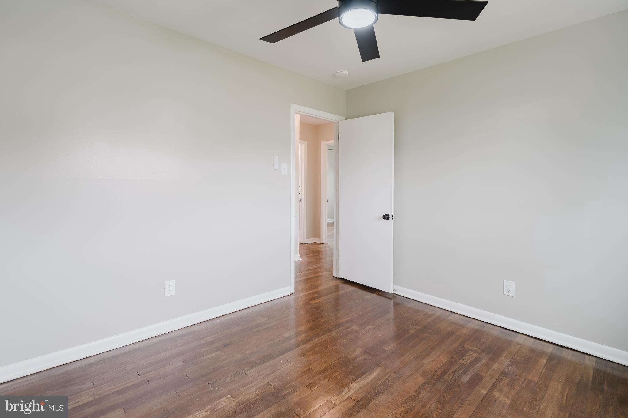 103 Durso Drive Newark, DE 19711 - Photo 18 of 21 an empty room with wooden floor and ceiling fan
