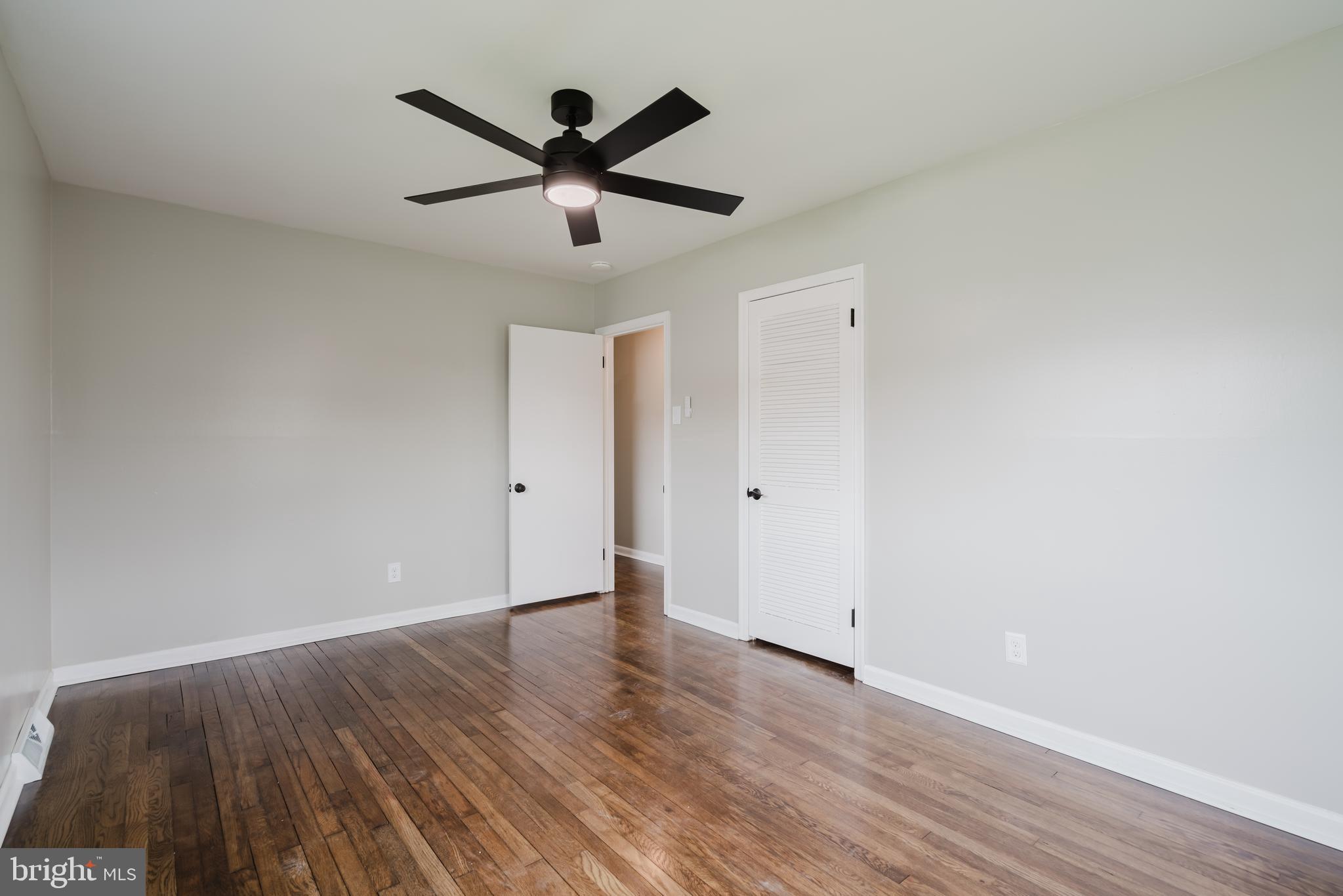 103 Durso Drive Newark, DE 19711 - Photo 19 of 21 an empty room with wooden floor and a ceiling fan