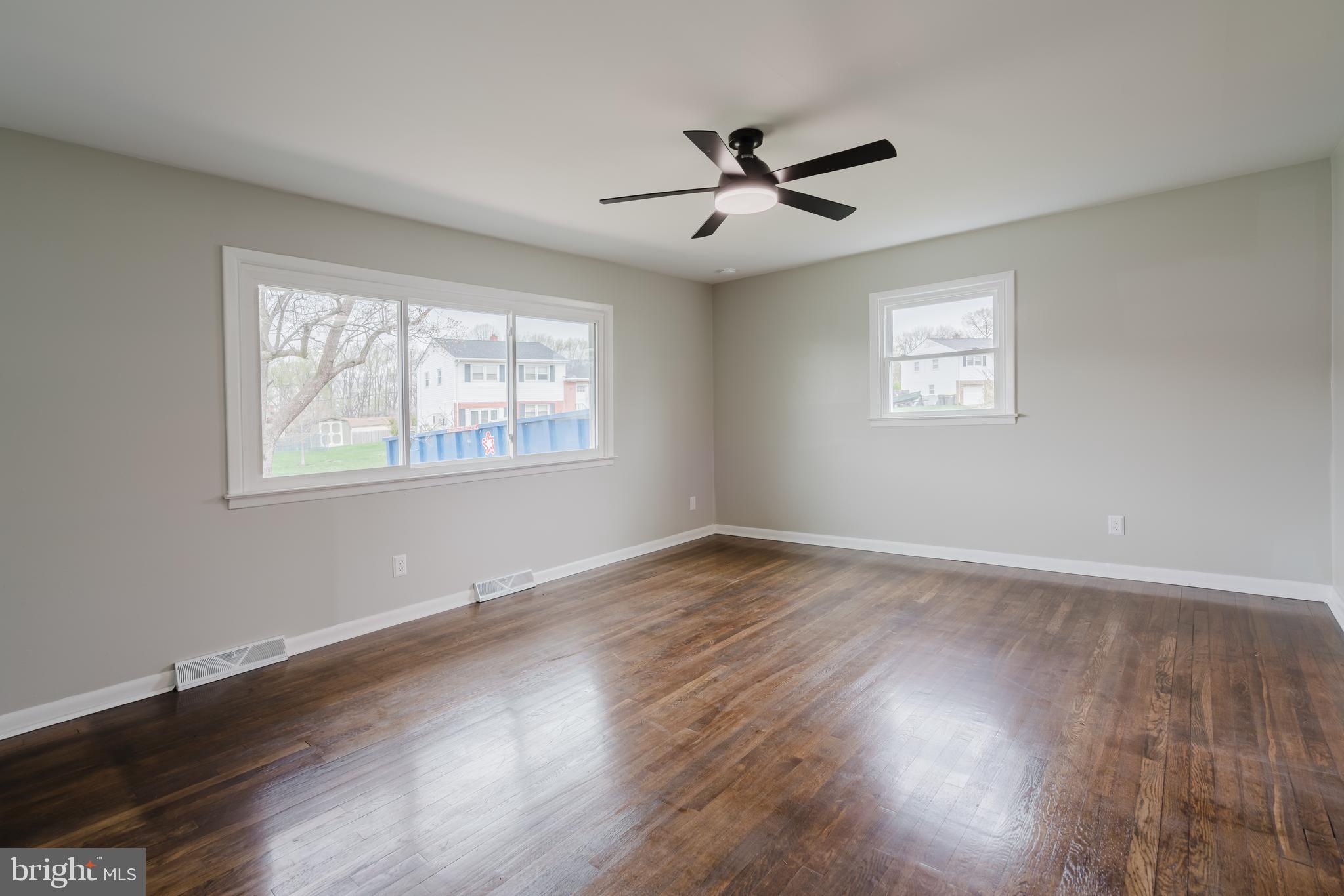 103 Durso Drive Newark, DE 19711 - Photo 2 of 21 a view of empty room with wooden floor and fan
