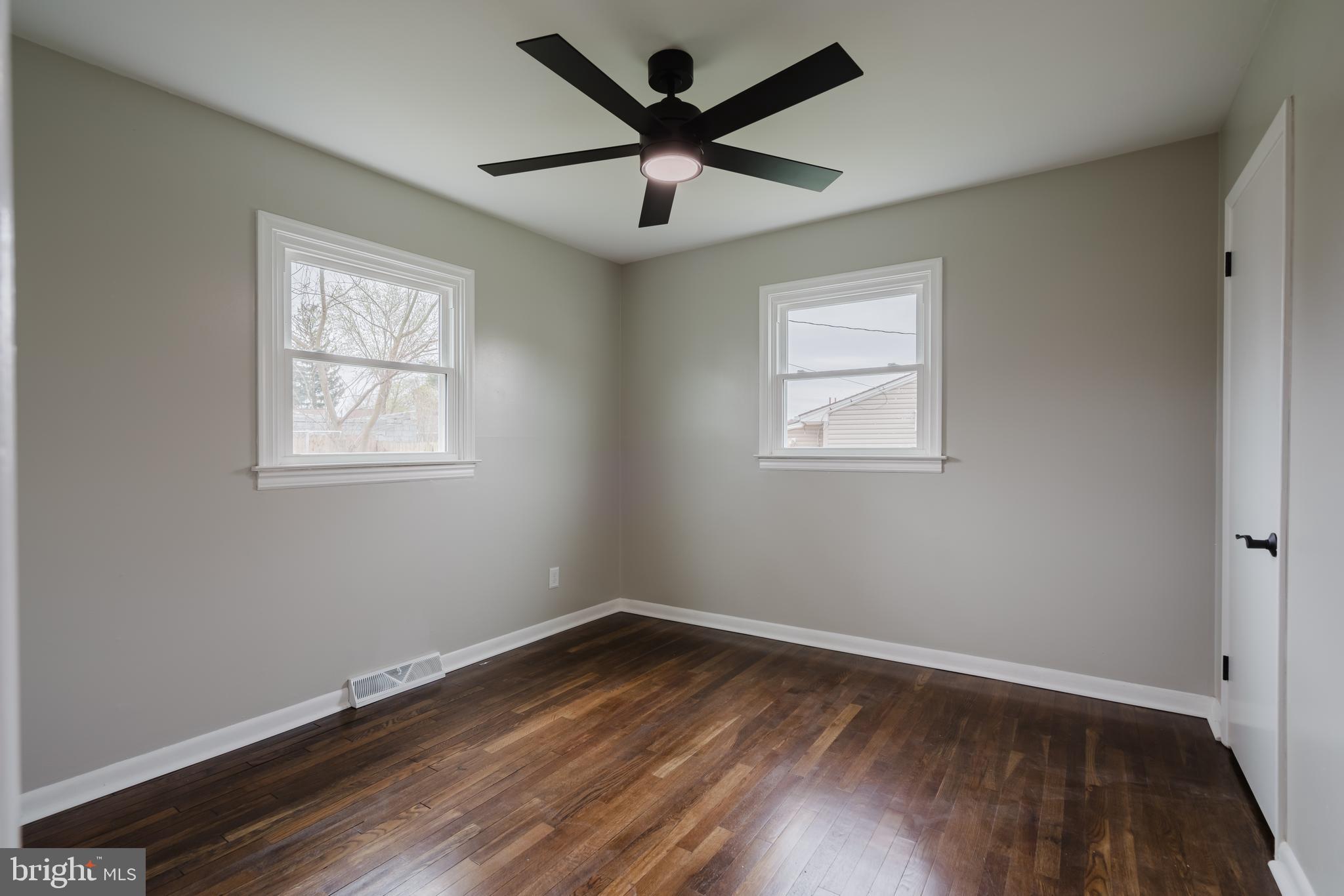 103 Durso Drive Newark, DE 19711 - Photo 21 of 21 a view of empty room with wooden floor and fan