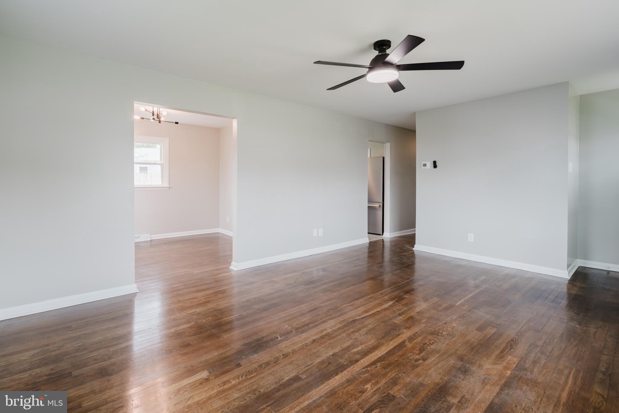 103 Durso Drive Newark, DE 19711 - Photo 3 of 21 a view of room with hardwood floor and a ceiling fan
