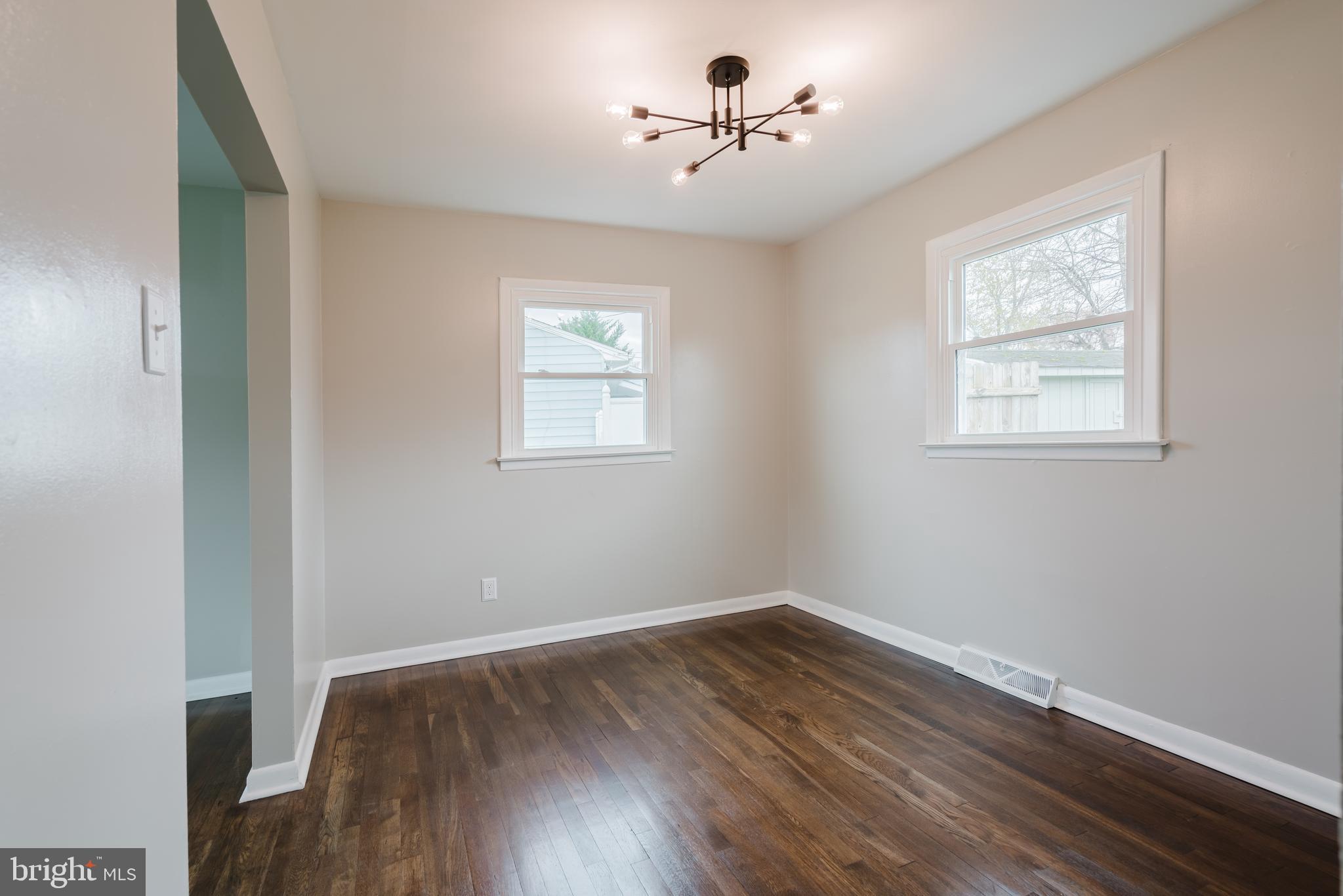 103 Durso Drive Newark, DE 19711 - Photo 5 of 21 a view of empty room with wooden floor and fan