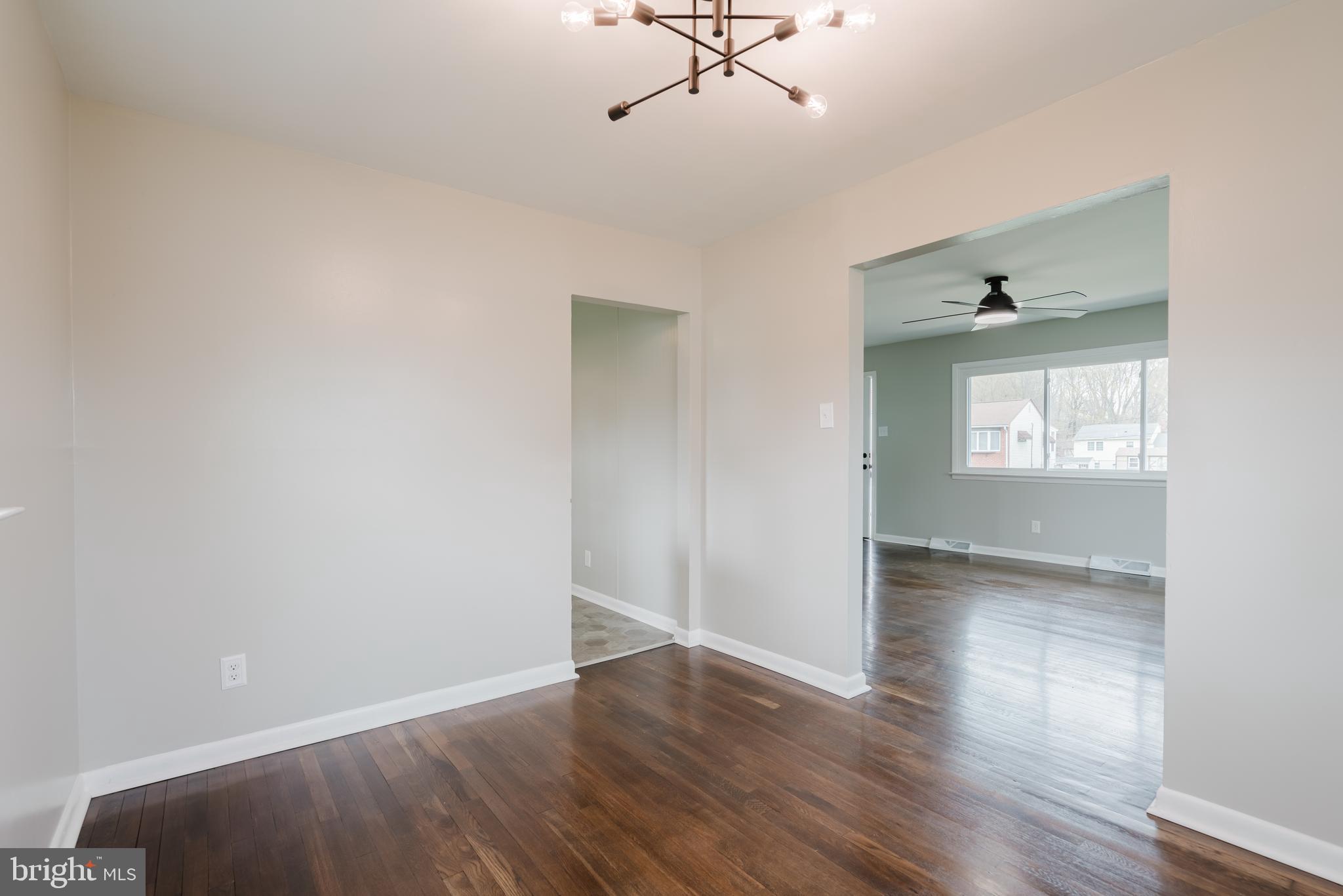 103 Durso Drive Newark, DE 19711 - Photo 6 of 21 a view of an empty room with wooden floor and a window