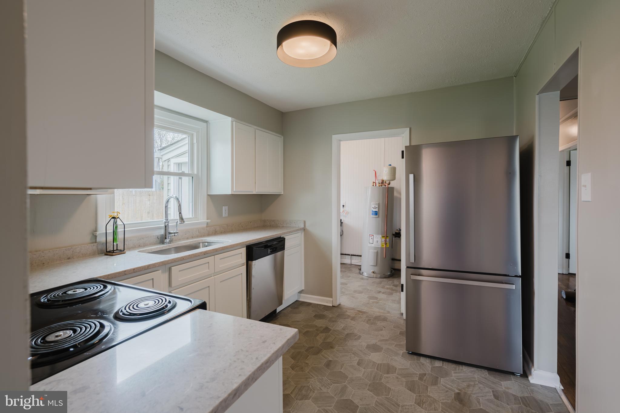 103 Durso Drive Newark, DE 19711 - Photo 10 of 21 a kitchen with a stove a refrigerator and a sink