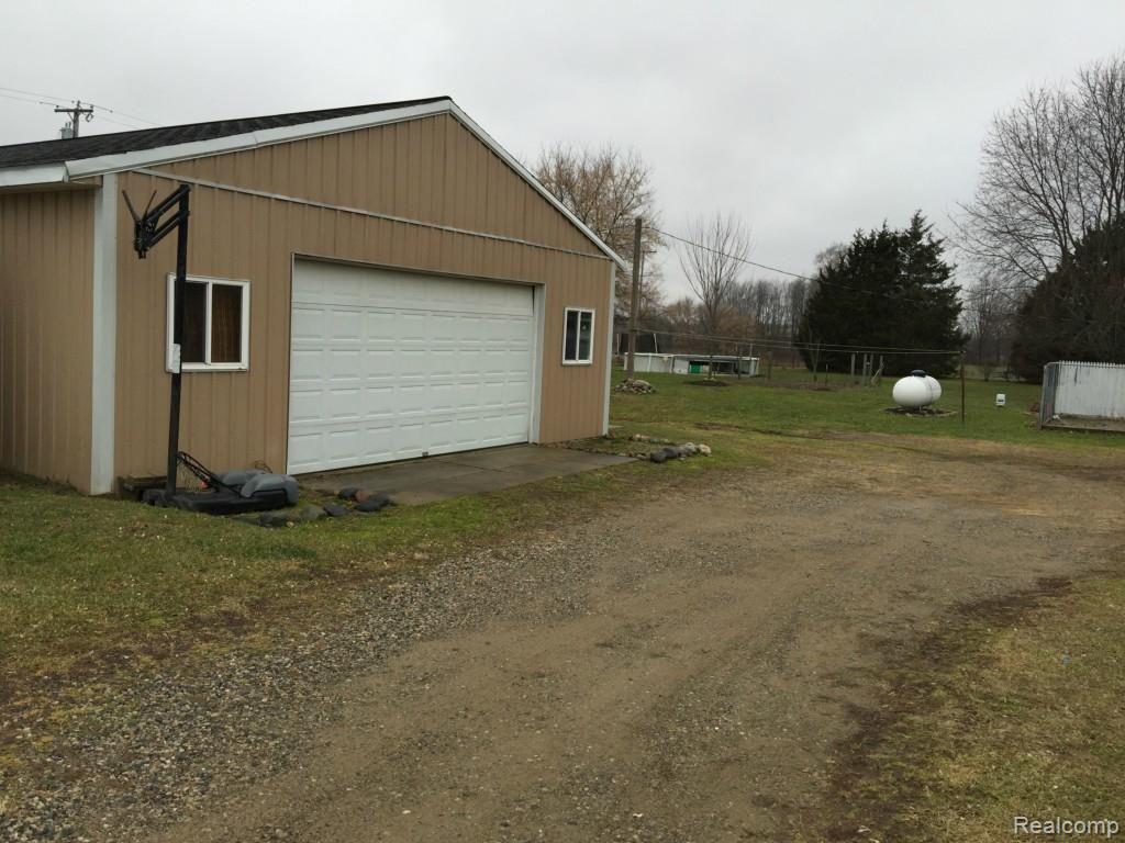 7305 Crofoot Road Fowlerville, MI 48836 - Photo 25 of 36 Pole barn looking towards back yard