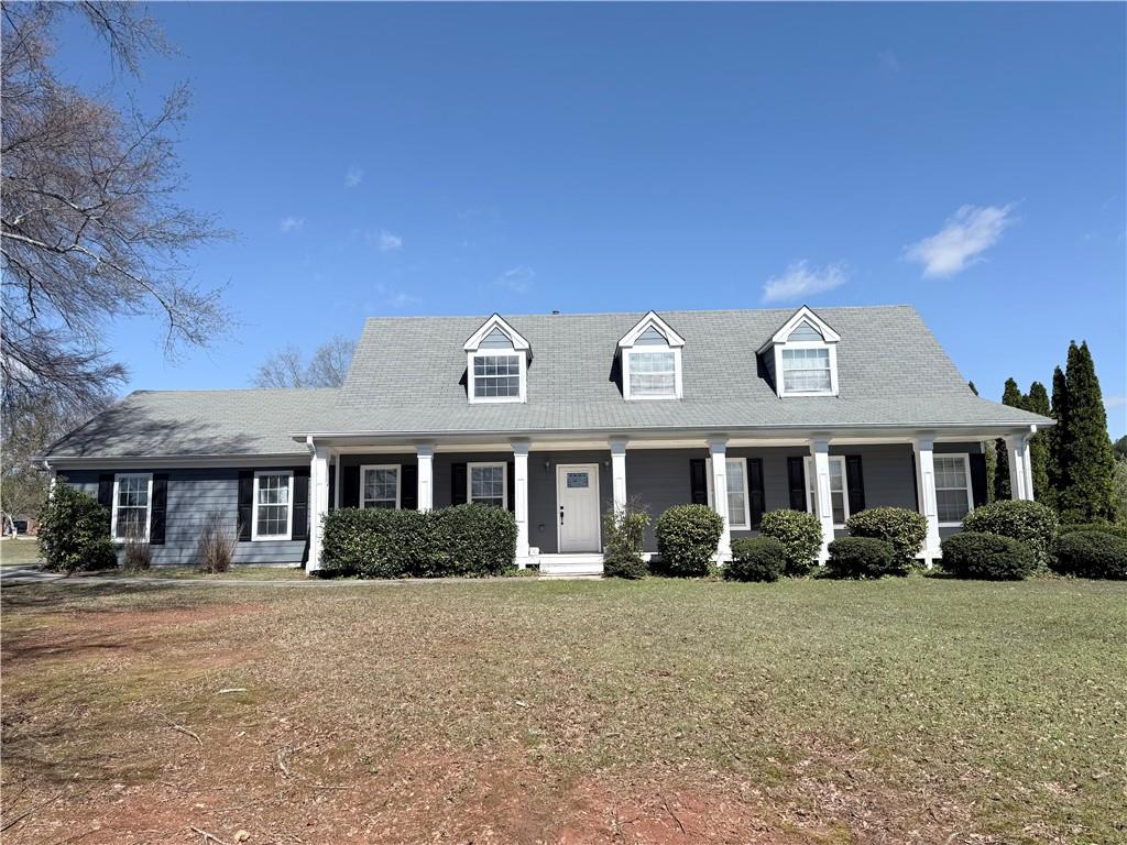 2000 Sage Court Loganville, GA 30052 - Photo 1 of 77 a front view of a house with garden