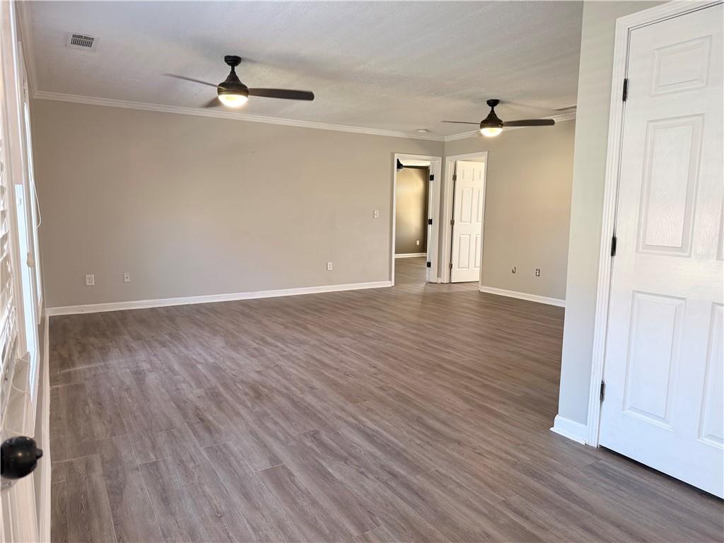 2000 Sage Court Loganville, GA 30052 - Photo 12 of 77 wooden floor in an empty room with a window
