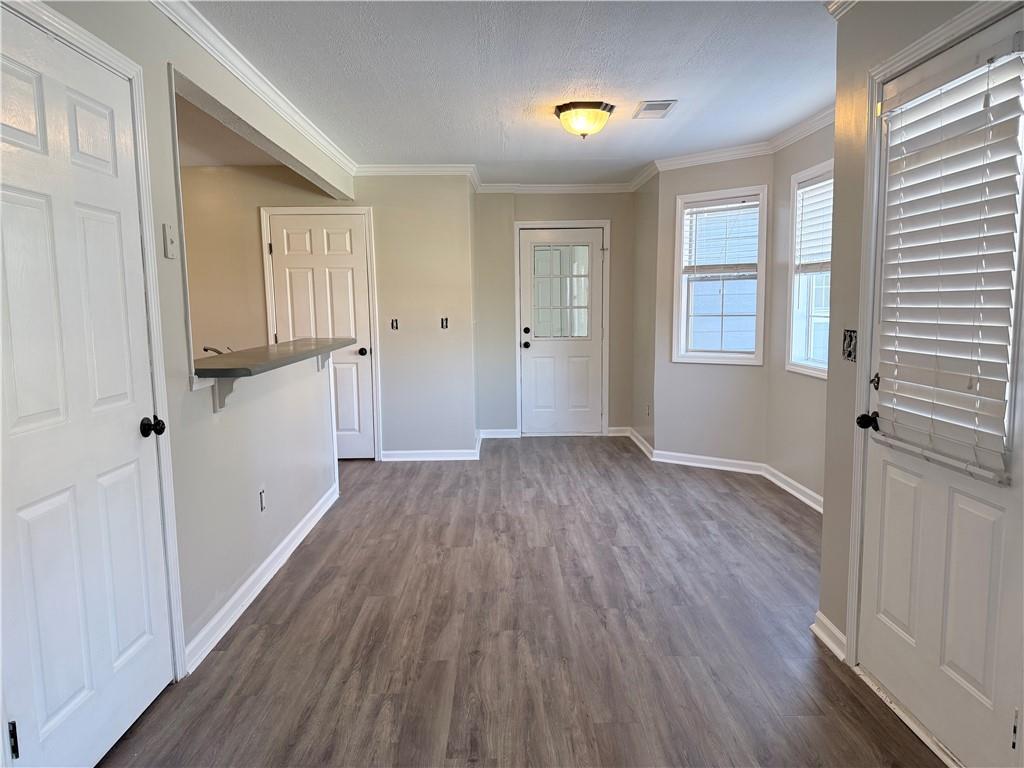 2000 Sage Court Loganville, GA 30052 - Photo 13 of 77 wooden floor in an empty room with a window