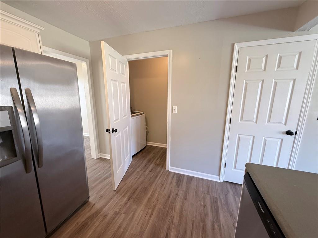 2000 Sage Court Loganville, GA 30052 - Photo 19 of 77 a view of a hallway with wooden floor and a livingroom