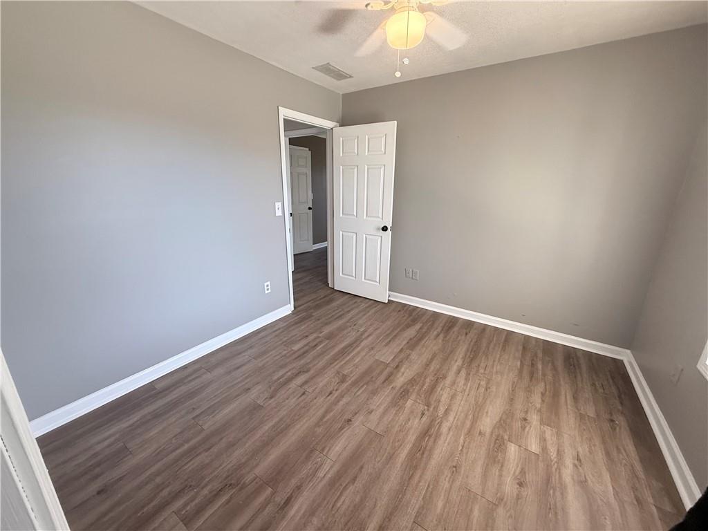 2000 Sage Court Loganville, GA 30052 - Photo 22 of 77 a view of an empty room with wooden floor