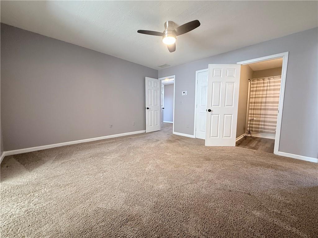 2000 Sage Court Loganville, GA 30052 - Photo 38 of 77 a view of an empty room with a ceiling fan