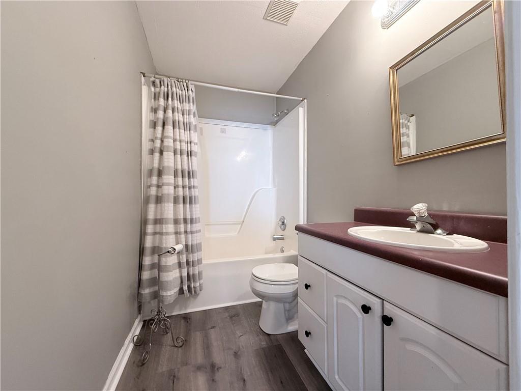 2000 Sage Court Loganville, GA 30052 - Photo 40 of 77 a bathroom with a sink a toilet and shower
