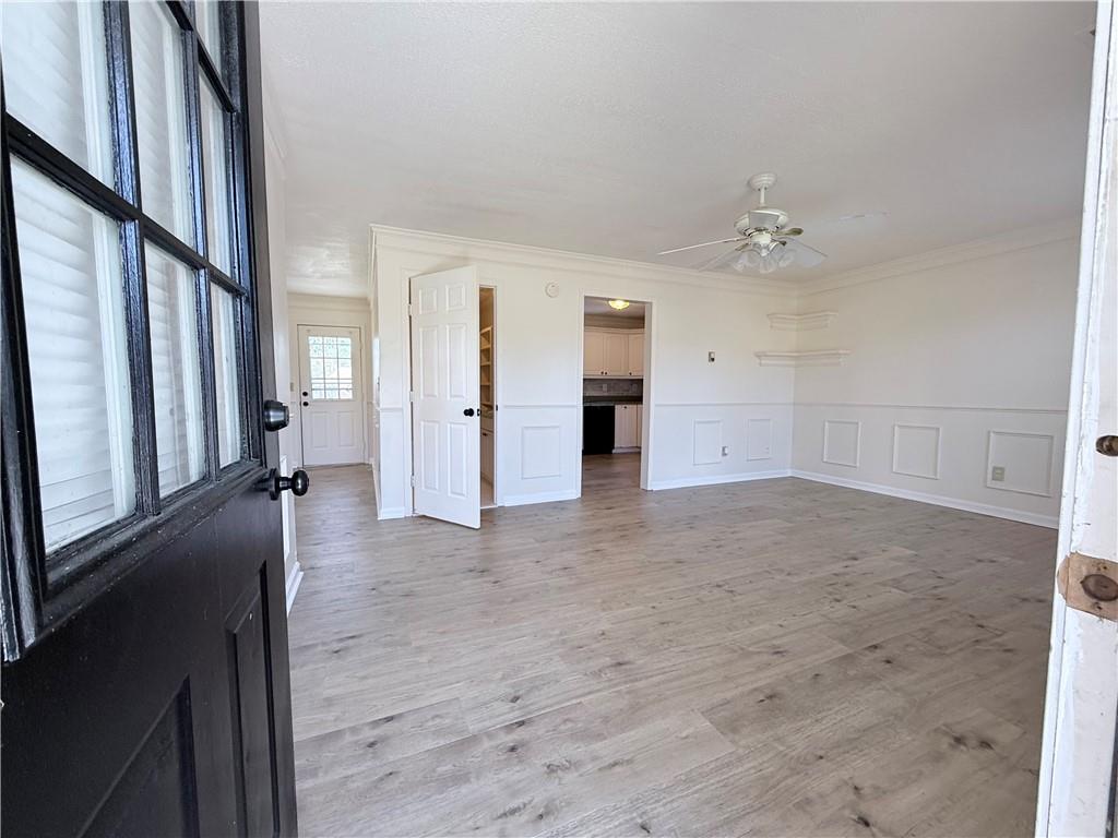 2000 Sage Court Loganville, GA 30052 - Photo 49 of 77 a view of a livingroom with wooden floor and stairs