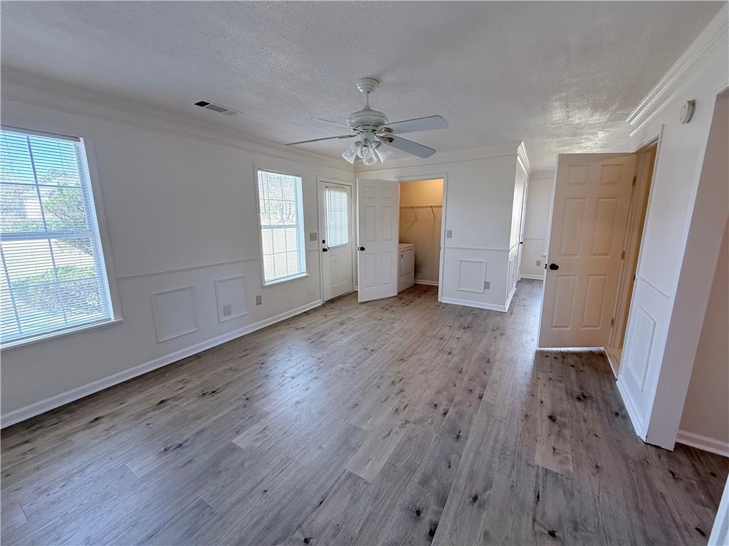 2000 Sage Court Loganville, GA 30052 - Photo 51 of 77 an empty room with wooden floor and windows