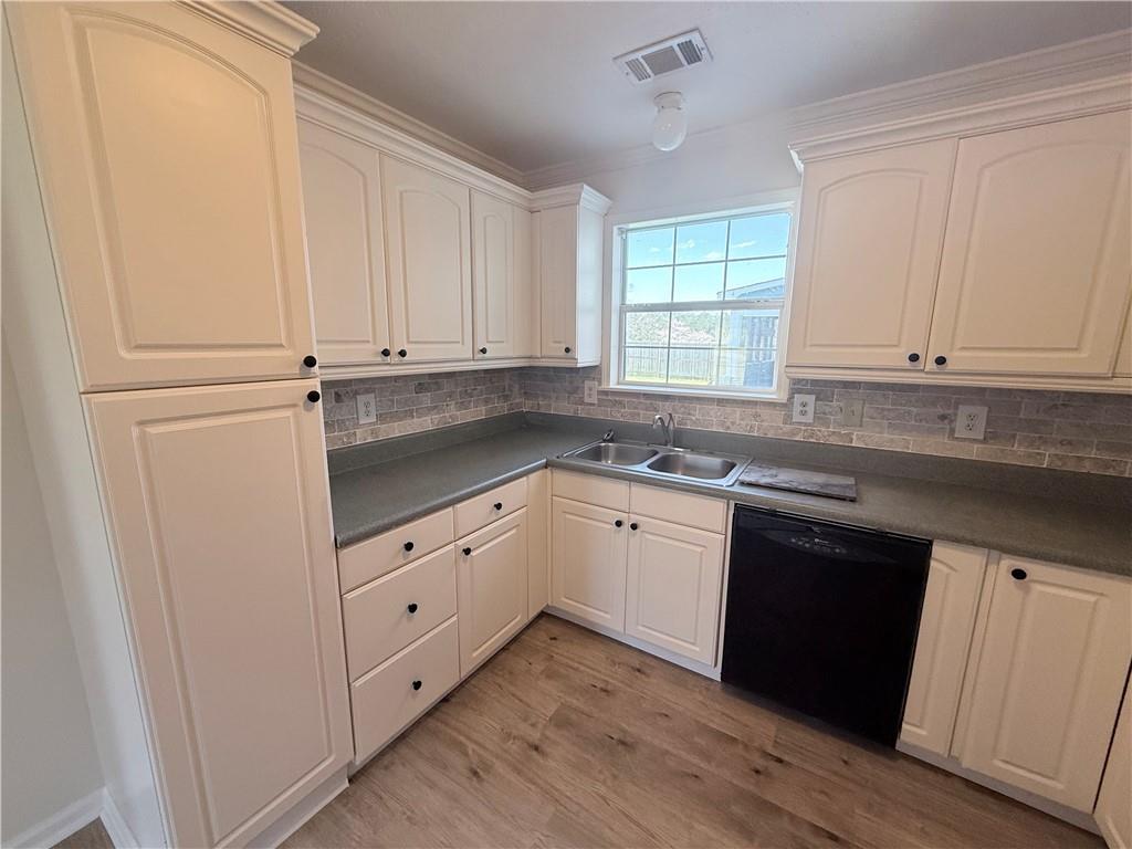 2000 Sage Court Loganville, GA 30052 - Photo 55 of 77 a kitchen with granite countertop white cabinets and white appliances