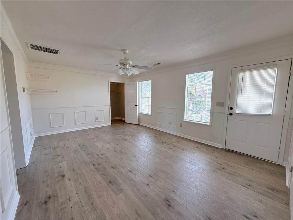 2000 Sage Court Loganville, GA 30052 - Photo 61 of 77 an empty room with wooden floor and windows