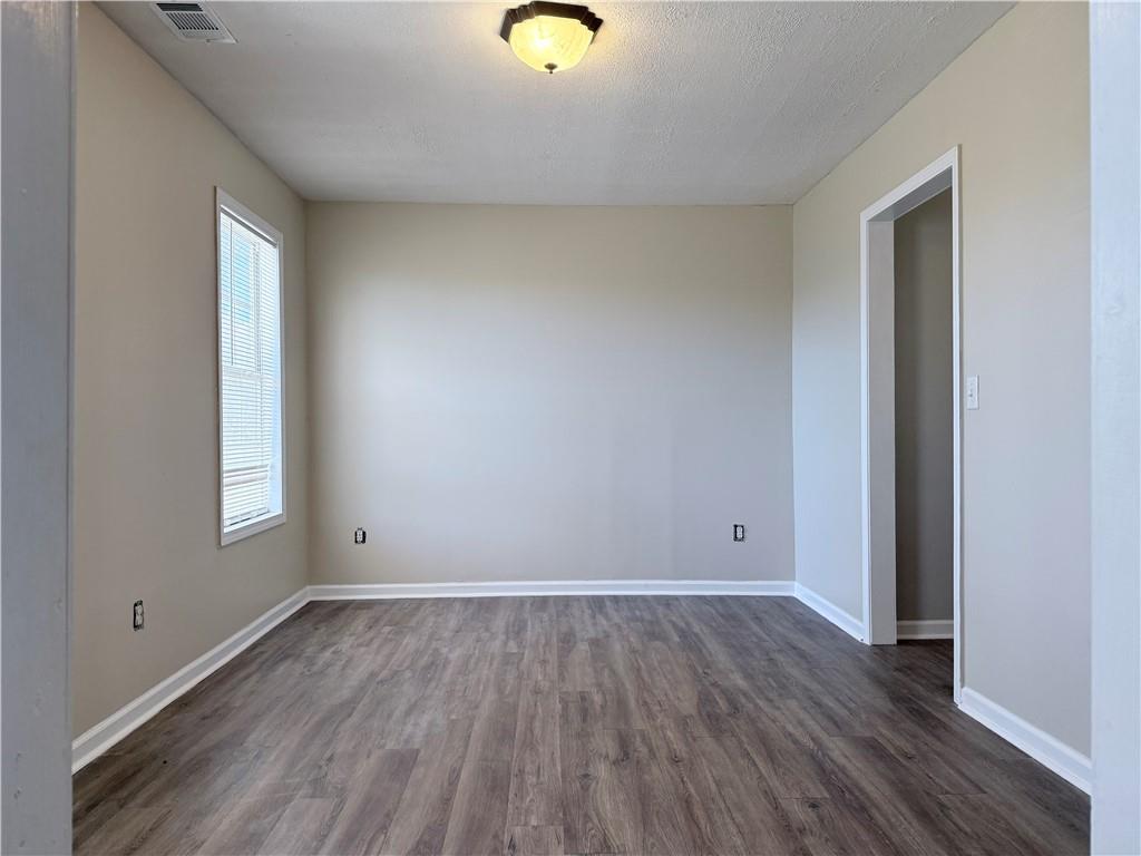 2000 Sage Court Loganville, GA 30052 - Photo 10 of 77 a view of a room with wooden floor and window