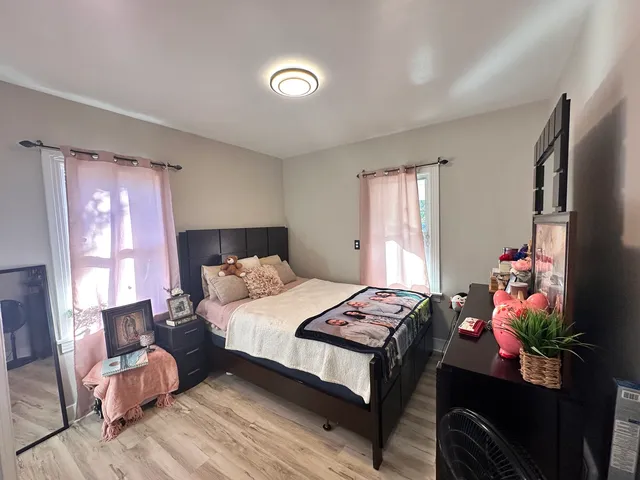 a bedroom with a bed and a dresser