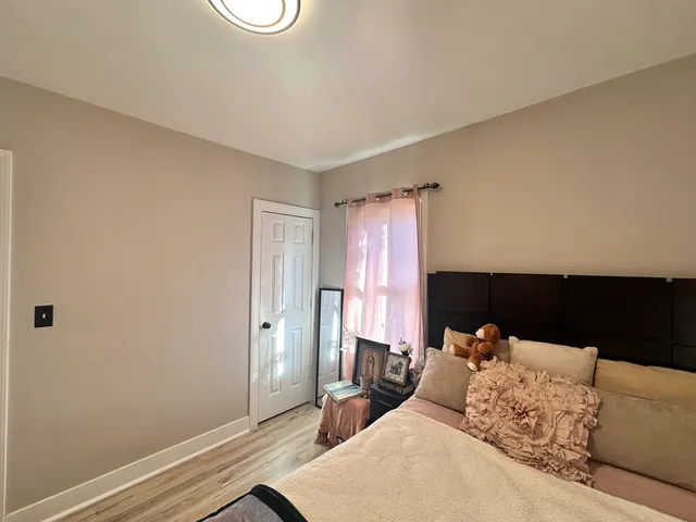a bed room with a bed and a window