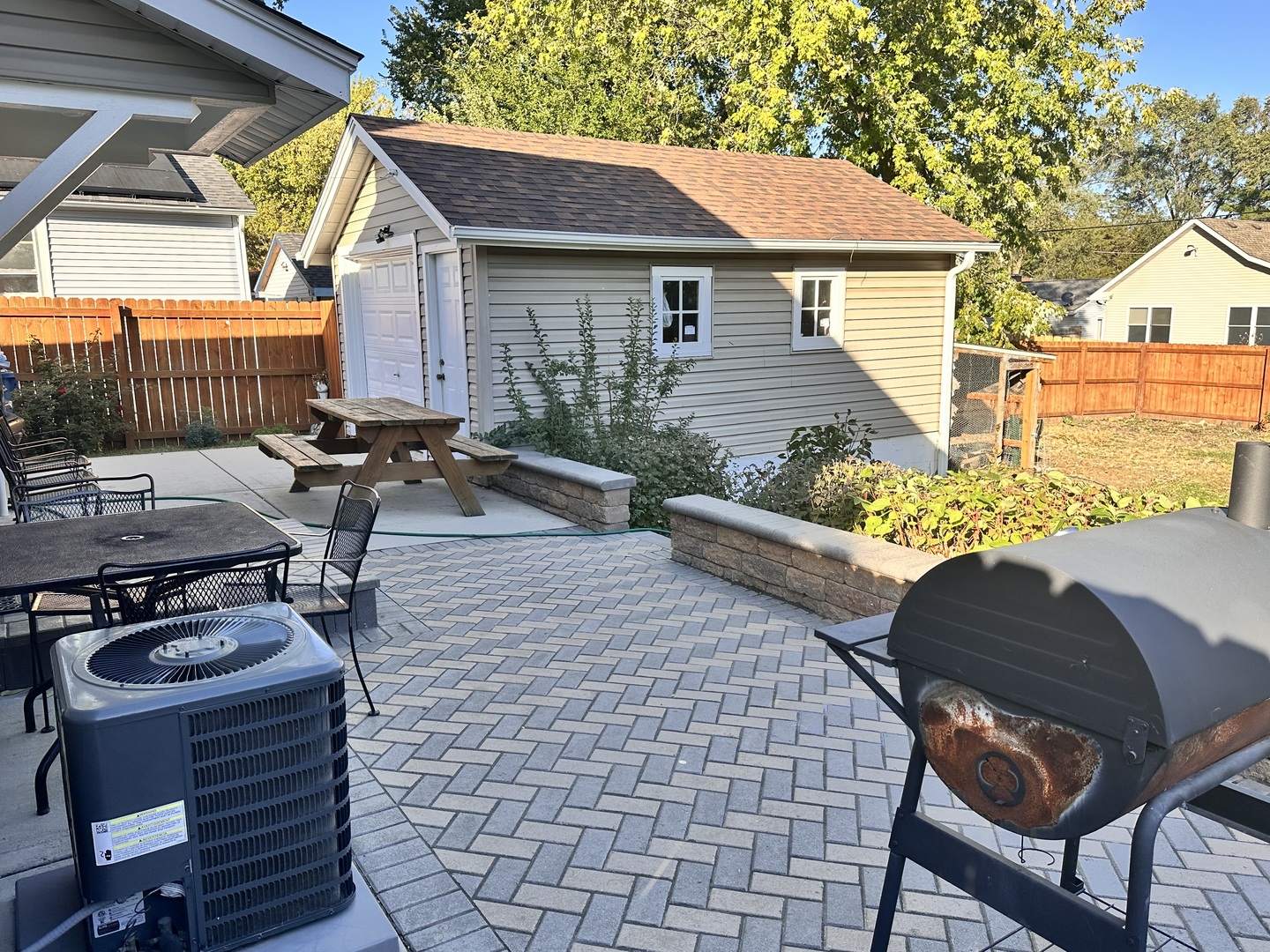 131 North Kendall Street Aurora, IL 60505 - Photo 24 of 29 a view of a patio with table and chairs with wooden fence