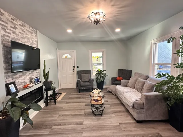 a living room with furniture and a flat screen tv