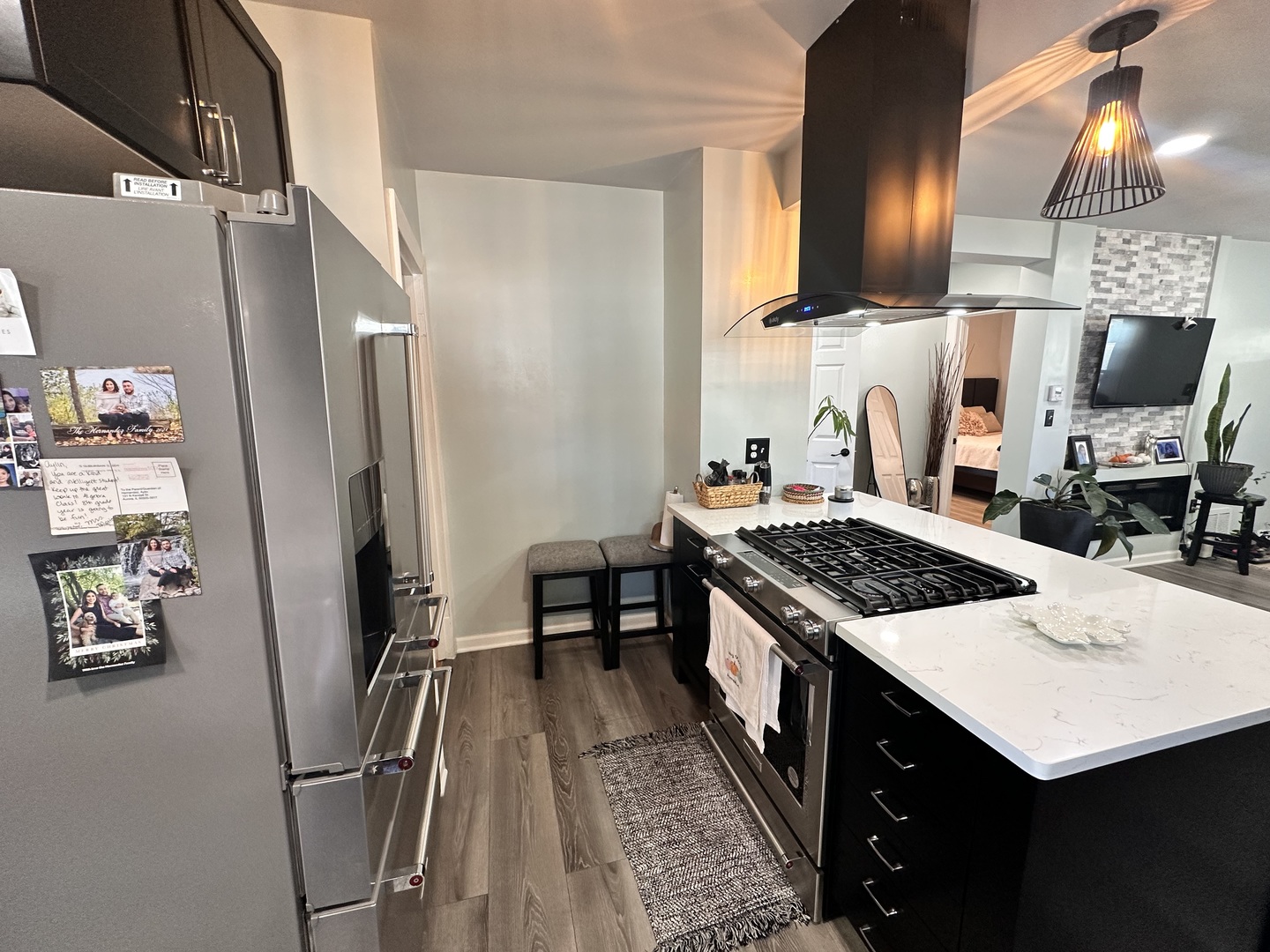 131 North Kendall Street Aurora, IL 60505 - Photo 8 of 29 a kitchen with stainless steel appliances a stove a refrigerator and a sink