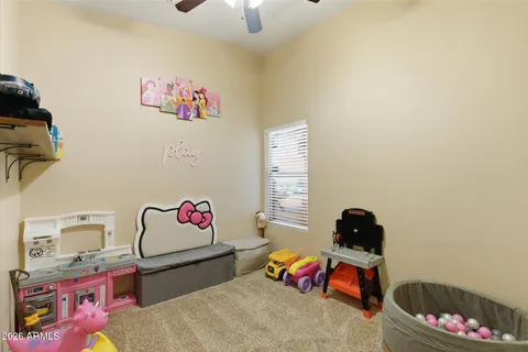 a bedroom with furniture and a window