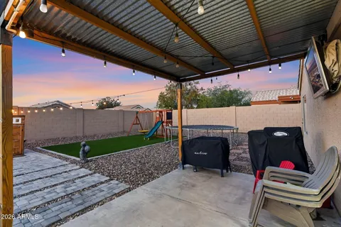 a front view of house with backyard and seating space
