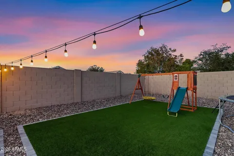 a view of a outdoor space with a street from a window