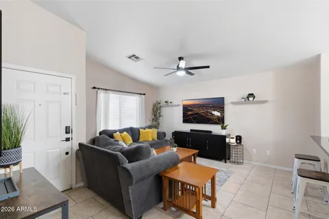 a living room with furniture and a flat screen tv