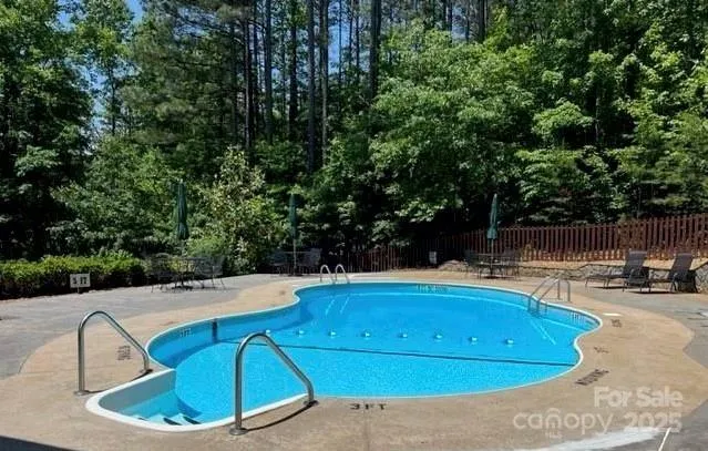a view of a swimming pool with a patio