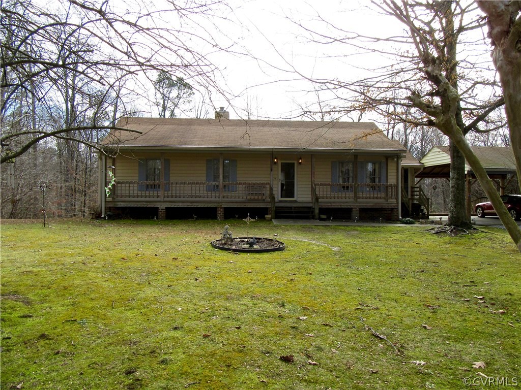Welcome to this Charming Vinyl-Sided Ranch on a Pr