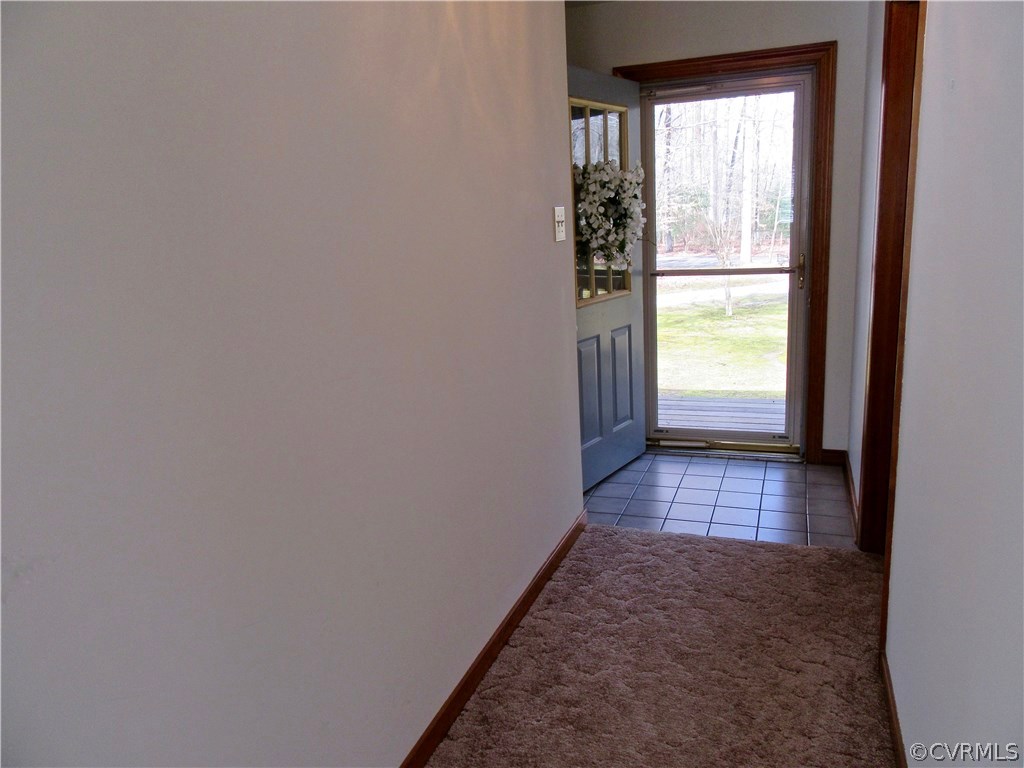 6627 Sycamore Road Quinton, VA 23141 - Photo 19 of 25 View of the Foyer with a Storm Door and Tile Floor