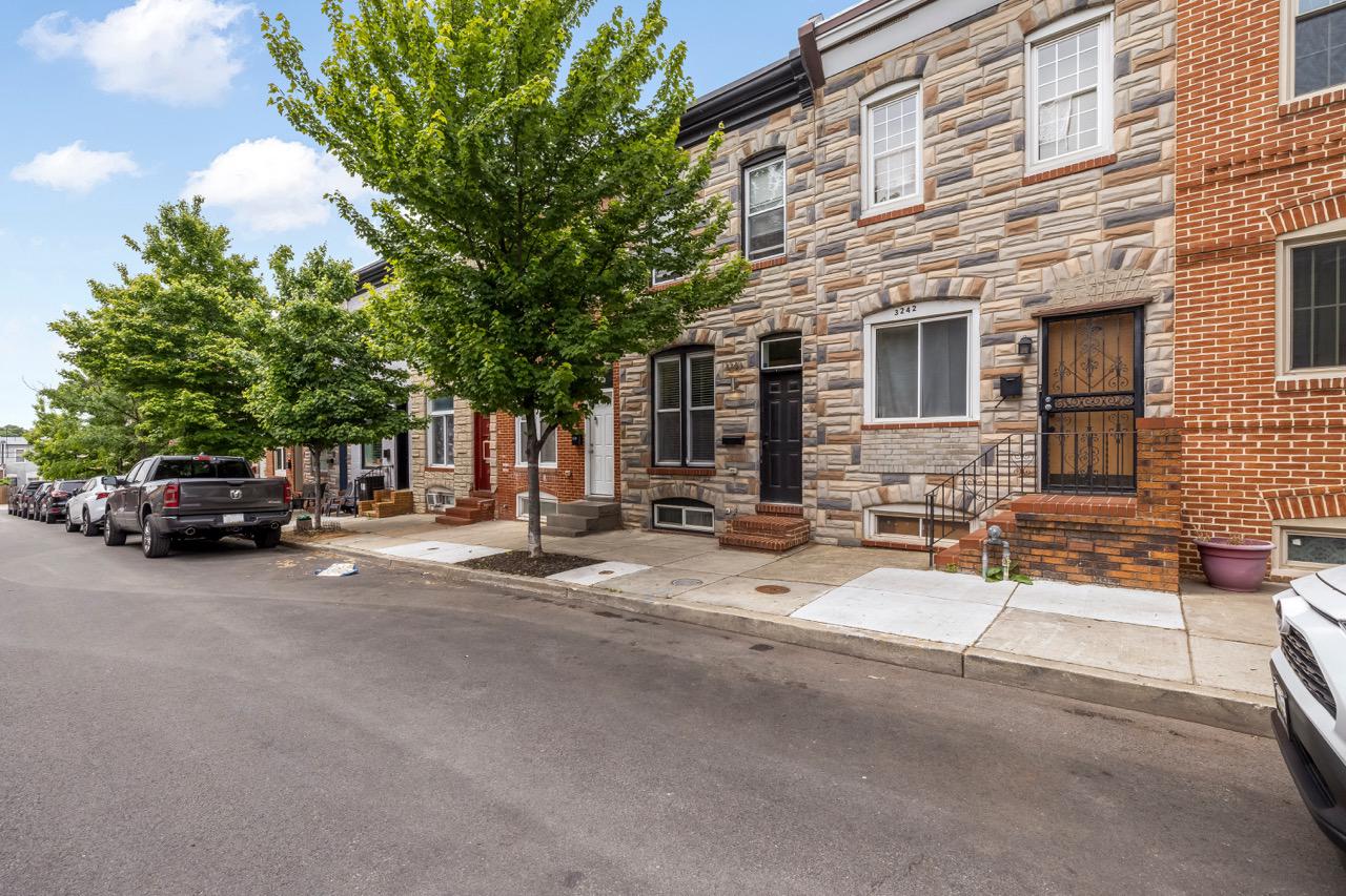 3240 Leverton Avenue Baltimore, MD 21224 - Photo 3 of 22 Charming row home with lush greenery.
