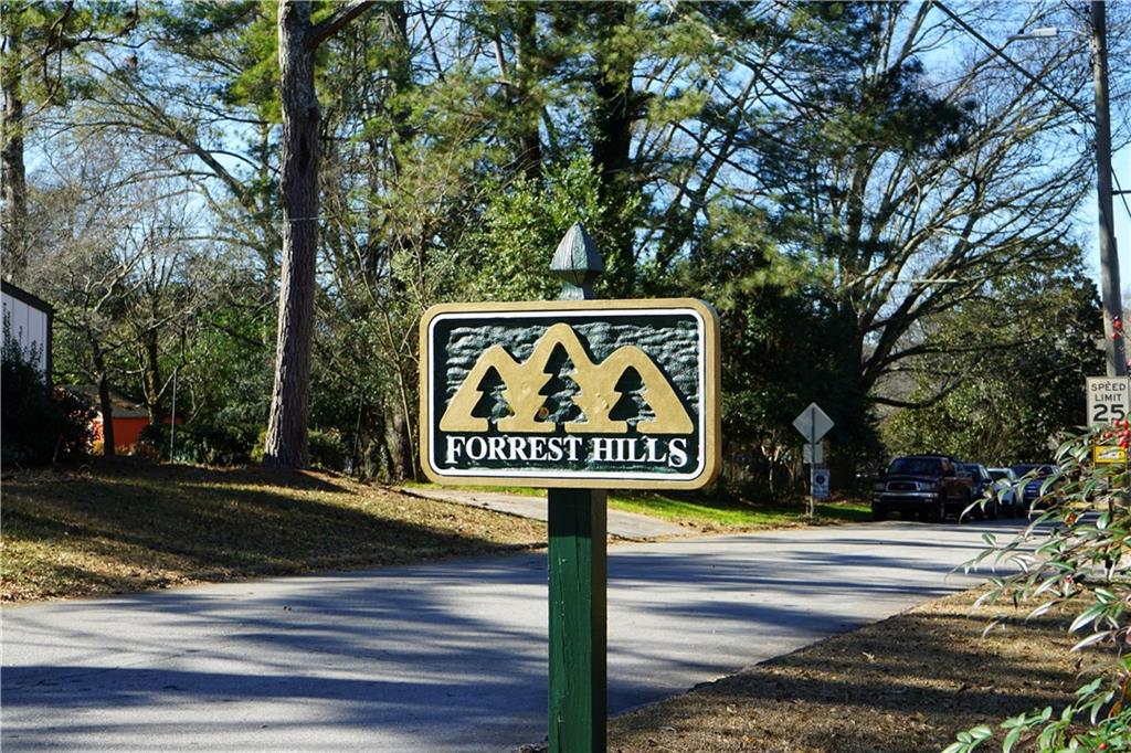 953 Forrest Boulevard Decatur, GA 30030 - Photo 2 of 2 a sign on a pole on a street
