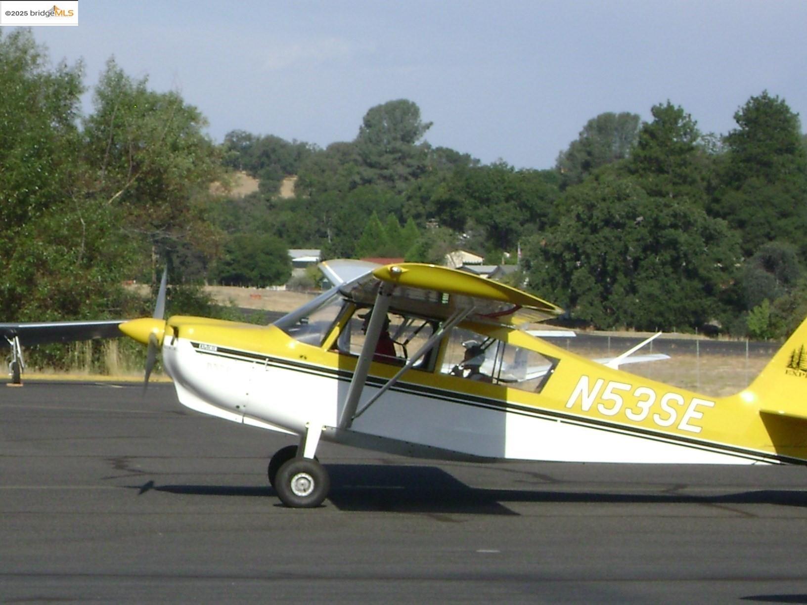 7-62a Ferretti Road Groveland, CA 95321 - Photo 23 of 28 a view of a swimming pool with a bench and wooden floor