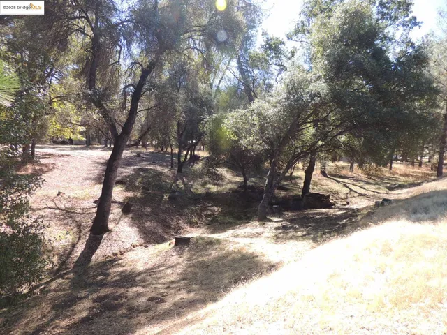 a view of snow on the side of a road