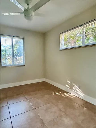 a view of a tree in front of a house