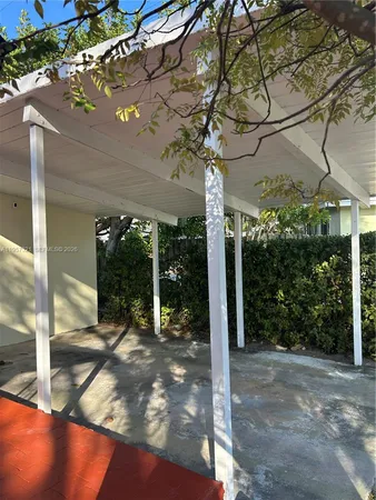 a wooden fence with trees in the background