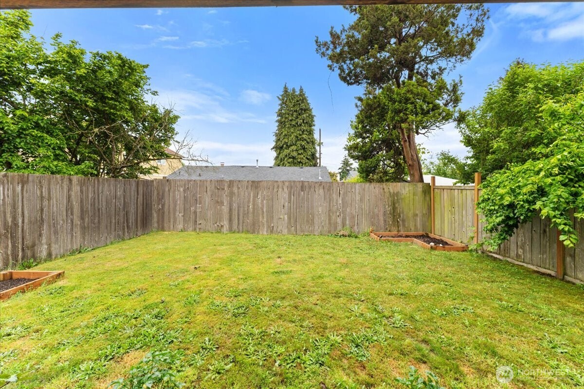 12418 2nd Place Southwest Burien, WA 98146 - Photo 32 of 39 a view of outdoor space with wooden fence