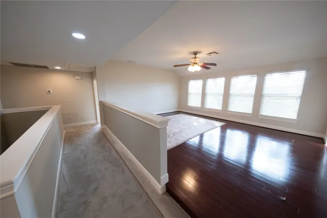a view of an entryway with wooden floor