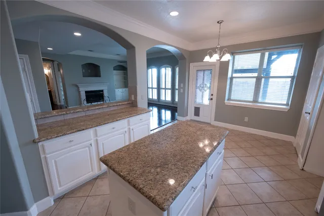 a kitchen with a sink a counter space and a window