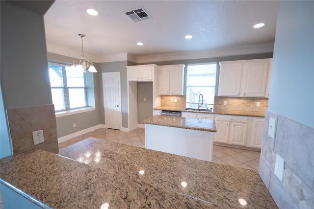 a large kitchen with kitchen island a sink window and stainless steel appliances