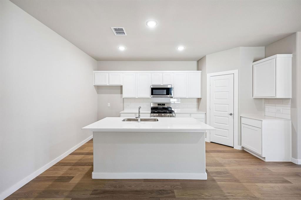 333 Millwood Road Lavon, TX 75166 - Photo 8 of 36 Kitchen in the Willow home plan by Trophy Signature Homes – REPRESENTATIVE PHOTO