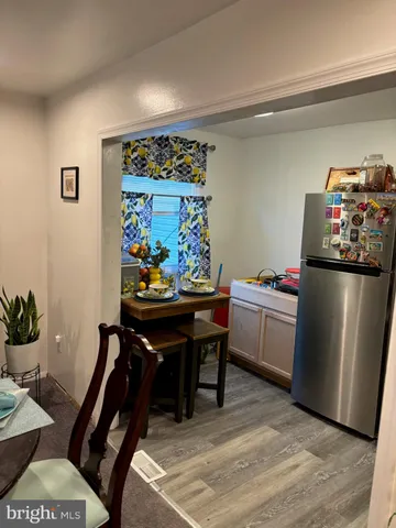 a room with furniture a rug and a painting on the wall