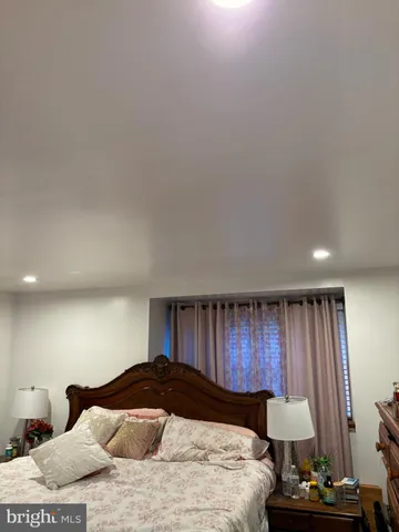 a bedroom with a bed and a closet