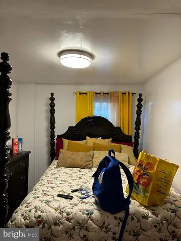 a bedroom with a bed and a closet